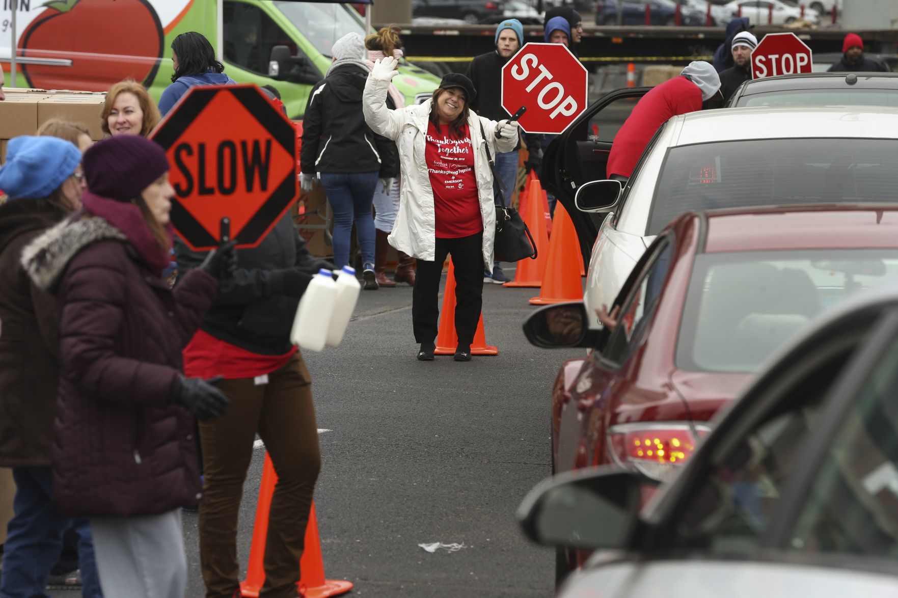 Volunteers work at 'Thanksgiving Together' food giveaway